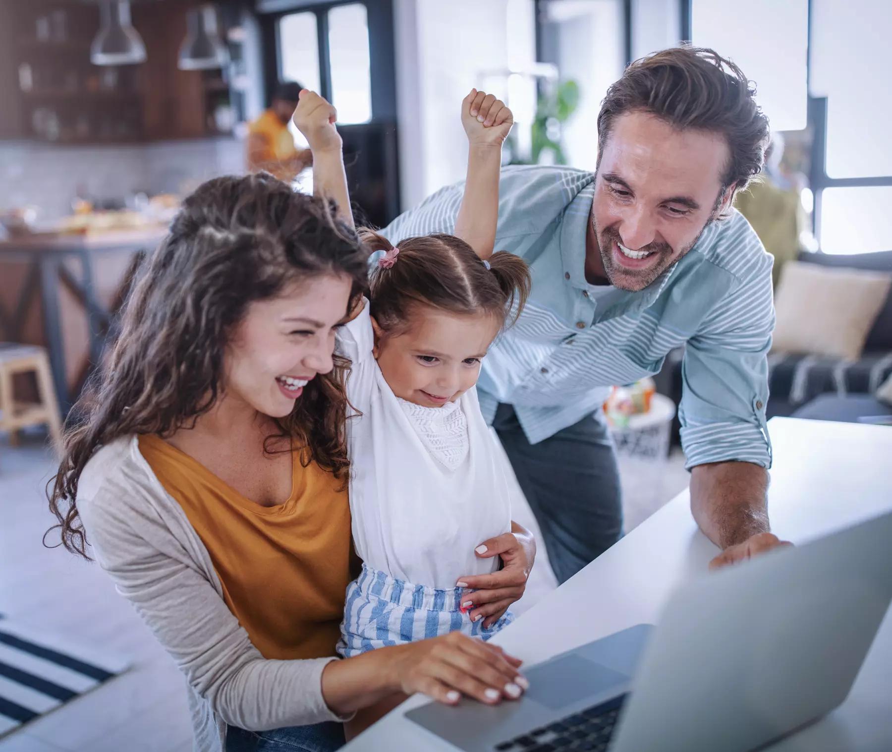 a family on a computer excited to open a donor advised fund
